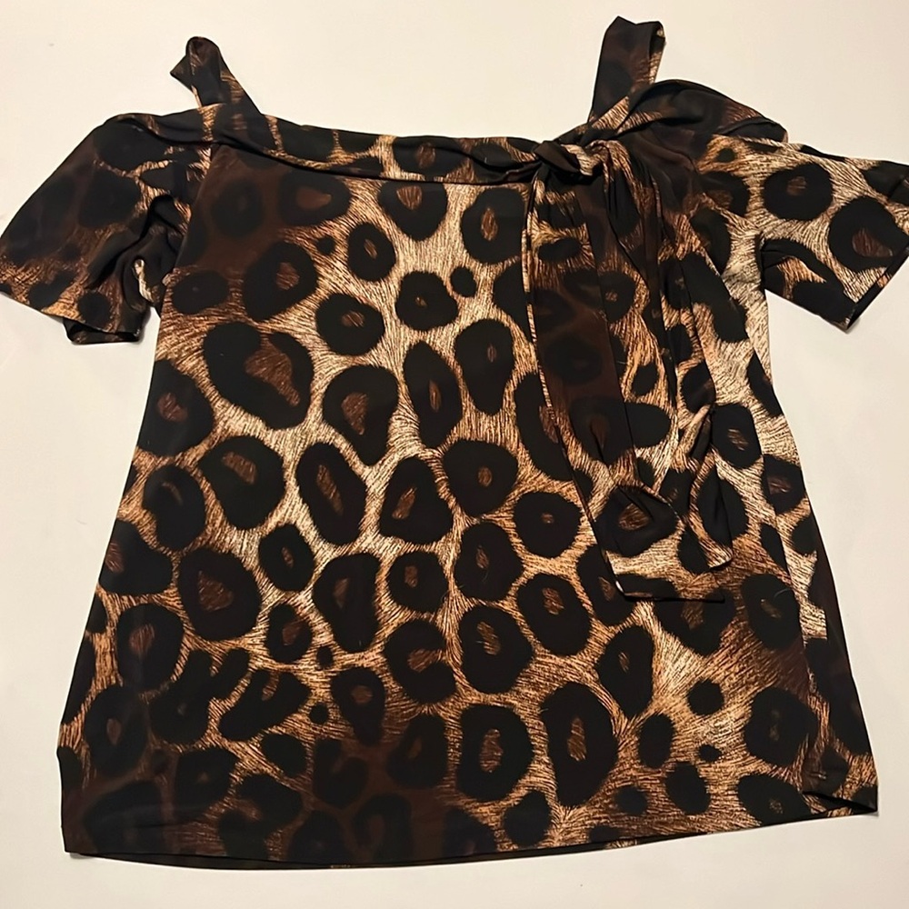 This is a large off the shoulder blouse in a leopard print.